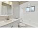 Clean bathroom features white subway tile shower/bath and a white vanity with modern hardware at 683 Anderson Dr, Deltona, FL 32725