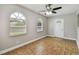 Bedroom with tile flooring, natural light, and an entrance door at 683 Anderson Dr, Deltona, FL 32725