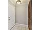 Welcoming entryway featuring tiled floors and a convenient coat closet at 683 Anderson Dr, Deltona, FL 32725