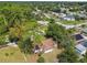 Charming single-story home with a brown roof surrounded by mature trees, offering a peaceful neighborhood setting at 683 Anderson Dr, Deltona, FL 32725