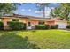 Charming single-story home with a well-manicured lawn and a two-car attached garage at 683 Anderson Dr, Deltona, FL 32725