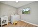 Functional laundry room featuring a washer, dryer, utility sink, and natural light from a large window at 683 Anderson Dr, Deltona, FL 32725