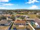 Aerial view of neighborhood, showcasing a house with backyard at 1371 Laurel Glen Dr, Bartow, FL 33830