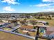 Aerial view of neighborhood, highlighting a home with patio at 1371 Laurel Glen Dr, Bartow, FL 33830