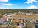 Aerial view of neighborhood, showcasing a home with backyard at 1371 Laurel Glen Dr, Bartow, FL 33830