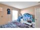 Bedroom with double bed, window, and built-in shelving at 1371 Laurel Glen Dr, Bartow, FL 33830