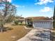 House exterior showcasing a tree and lawn at 1371 Laurel Glen Dr, Bartow, FL 33830