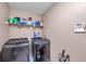 Laundry room with washer, dryer, and shelving at 1371 Laurel Glen Dr, Bartow, FL 33830