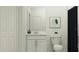 Simple bathroom with white vanity and black shower curtain at 858 Hour Glass Rd, Lakeland, FL 33801