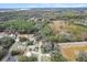 Aerial view of homes and land in a wooded area at 11730 Sw 230Th Avenue Rd, Dunnellon, FL 34431