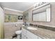 Bathroom with granite countertop, decorative tile accent, window and ducky decor at 11730 Sw 230Th Avenue Rd, Dunnellon, FL 34431