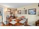 A well-lit dining room with a large wooden table at 11730 Sw 230Th Avenue Rd, Dunnellon, FL 34431