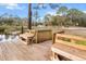 Wooden dock with seating area, offering tranquil views at 11730 Sw 230Th Avenue Rd, Dunnellon, FL 34431