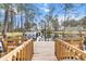 Wooden dock with benches and boats on the canal at 11730 Sw 230Th Avenue Rd, Dunnellon, FL 34431