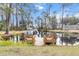 Wooden dock with benches overlooking a calm canal at 11730 Sw 230Th Avenue Rd, Dunnellon, FL 34431