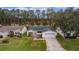 Aerial view of a single-Gathering home with a green roof and driveway at 1309 Ballesteros Dr, The Villages, FL 32162