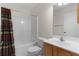 Bathroom with shower/tub combo and wood cabinet at 1309 Ballesteros Dr, The Villages, FL 32162