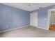 Large bedroom featuring light purple walls and a double door closet at 1309 Ballesteros Dr, The Villages, FL 32162