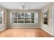 Dining room with hardwood floors and large windows at 1309 Ballesteros Dr, The Villages, FL 32162