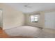 Living room with carpet and hardwood flooring, a ceiling fan and window at 1309 Ballesteros Dr, The Villages, FL 32162