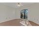 Bright bedroom featuring hardwood floors and arched window at 2160 Boardman Rd, Bartow, FL 33830