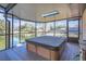 Relaxing hot tub on screened porch overlooking lake at 2160 Boardman Rd, Bartow, FL 33830