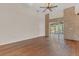 Spacious living room featuring hardwood floors and brick fireplace at 2160 Boardman Rd, Bartow, FL 33830