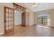 Sunlit living area with hardwood floors and French doors at 2160 Boardman Rd, Bartow, FL 33830