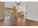 Open living area with wood floors and view to kitchen at 2160 Boardman Rd, Bartow, FL 33830