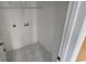 Neat laundry room with shelving and hookups at 30132 Pga Dr, Sorrento, FL 32776