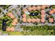 Overhead view of apartment complex, parking, and surrounding greenery at 3036 Parkway Blvd # 206, Kissimmee, FL 34747