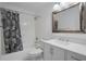 Clean bathroom, shower/tub combo, vanity, mirror at 3036 Parkway Blvd # 206, Kissimmee, FL 34747