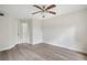 Spacious bedroom with ceiling fan and wood-look floors at 3036 Parkway Blvd # 206, Kissimmee, FL 34747