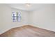 Bright bedroom with window and wood-look floors at 3036 Parkway Blvd # 206, Kissimmee, FL 34747