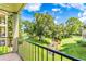 View from balcony overlooking a tranquil pond at 3036 Parkway Blvd # 206, Kissimmee, FL 34747