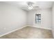 Bedroom with tile floors, a window, and a view of the pool at 5615 Driftwood Dr, Lakeland, FL 33809