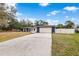 Front view of charming home with updated facade at 5615 Driftwood Dr, Lakeland, FL 33809