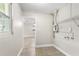 Convenient laundry room with shelving and hookups at 5615 Driftwood Dr, Lakeland, FL 33809