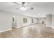 Spacious living room with tile floors and ceiling fan at 5615 Driftwood Dr, Lakeland, FL 33809