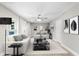 Virtually staged living room featuring a neutral color palette and modern furniture at 5615 Driftwood Dr, Lakeland, FL 33809