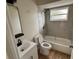 Updated bathroom with gray tile and a bathtub at 605 Aldama Ct, Ocoee, FL 34761