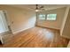 Large bedroom with wood-look flooring and neutral walls at 605 Aldama Ct, Ocoee, FL 34761