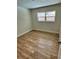 Bright bedroom with wood-look floors and ample natural light at 605 Aldama Ct, Ocoee, FL 34761