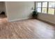 Living room with large window and wood-look floors at 605 Aldama Ct, Ocoee, FL 34761