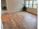 Living room features wood-look floors and large windows at 605 Aldama Ct, Ocoee, FL 34761