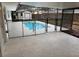 Enclosed pool area with patio and safety fence at 605 Aldama Ct, Ocoee, FL 34761