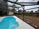 Screened-in pool and patio area with a spacious backyard at 605 Aldama Ct, Ocoee, FL 34761