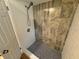 Walk-in shower with stylish tile and new fixtures at 605 Aldama Ct, Ocoee, FL 34761