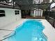 Relaxing kidney-shaped pool with screened enclosure at 605 Aldama Ct, Ocoee, FL 34761