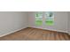 Bright bedroom with neutral carpeting and two large windows at 2204 Canyon Oak Dr, Davenport, FL 33837